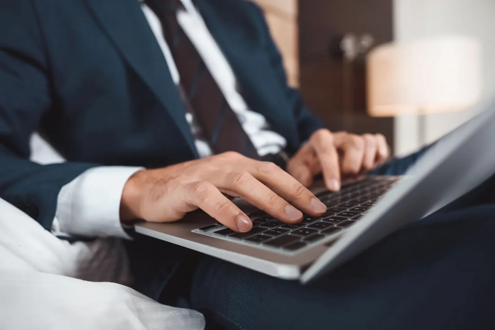 cropped-shot-of-businessman-in-formal-suit-sitting-2024-11-17-10-21-03-utc